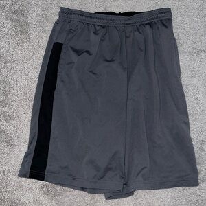 Grey with black stripe Reebok athletic shorts. Size M